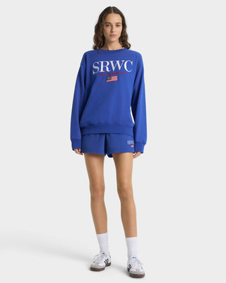 Person wearing a blue sweatshirt with 'SRWC' logo on a white background