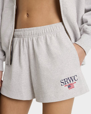 Gray shorts with 'SRWC' logo worn by a person on a plain background