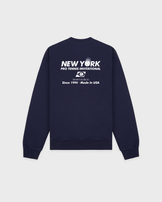 Navy blue sweatshirt with white text on the back on a light gray background