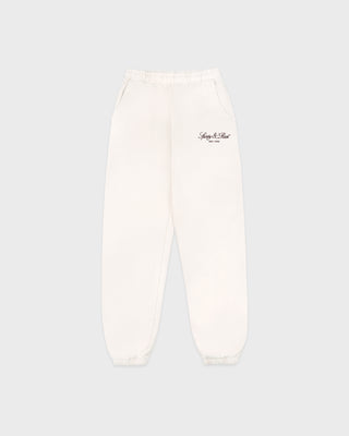 White sweatpants with a brand logo on a light gray background