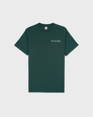 Green t-shirt with a small logo on a white background