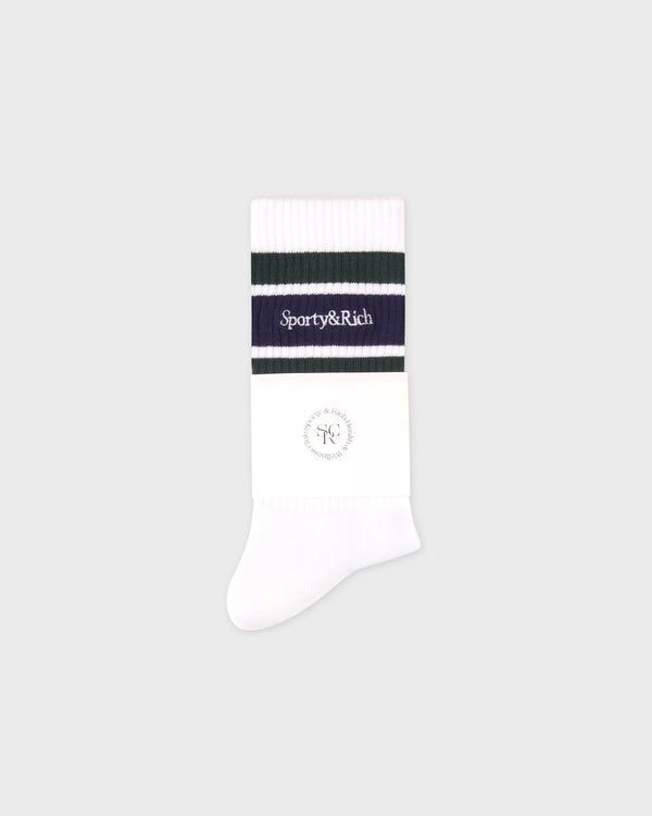 White sock with a black and purple striped band on a light gray background