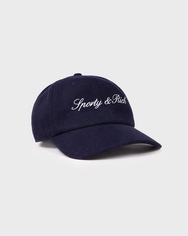 Navy blue cap with 'Sporty & Rich' logo on a light gray background
