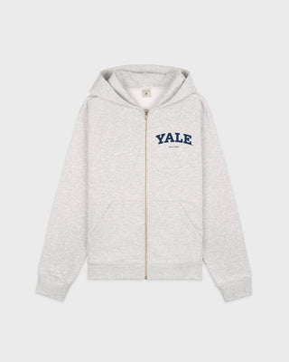Presenting the Yale Classic Zip Hoodie in Heather Gray/Navy: this oversized, garment-dyed zip-up features "YALE" printed in navy on the left chest. Made from 100% cotton for lasting comfort and durability, it's shown here against a white background.