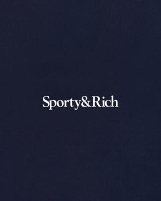 Sporty&Rich logo on a dark blue background
