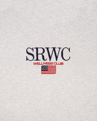 Gray sweatshirt with 'SRWC Wellness Club' text and American flag on a textured gray background