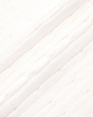 Close-up of white fabric with a subtle pattern