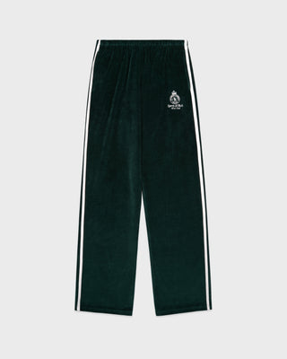 Green track pants with white stripes on a light gray background