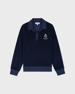 Navy blue sweater with a logo on a light gray background