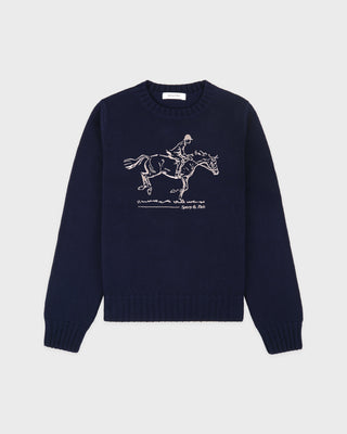 Navy blue sweater with white horse and rider graphic on a light gray background