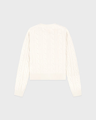 White ribbed sweater on a light gray background