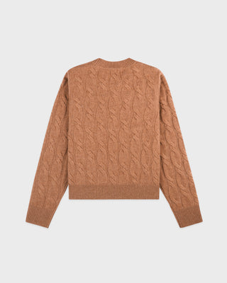 Brown cable knit sweater on a light gray background