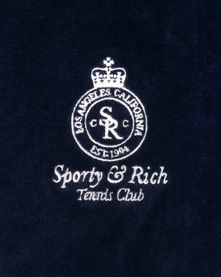 Embroidered logo and text on a dark background