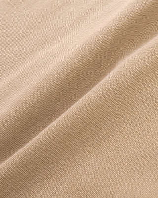 Close-up of beige fabric with visible texture