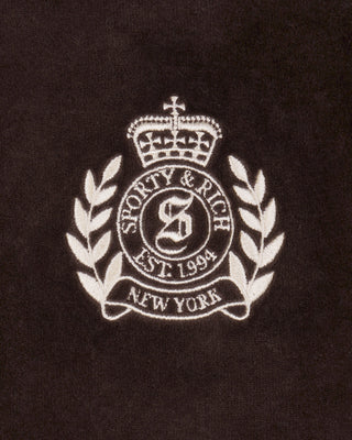 Logo of Sporty & Rich on a brown background