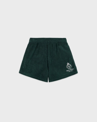 Green shorts with a logo on a light gray background