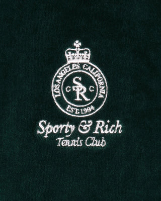 Embroidered logo and text on a black background