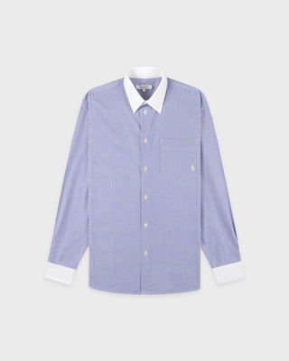 Blue striped shirt with white collar and cuffs on a light gray background