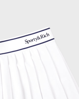 White garment with 'Sporty&Rich' logo on a light gray background