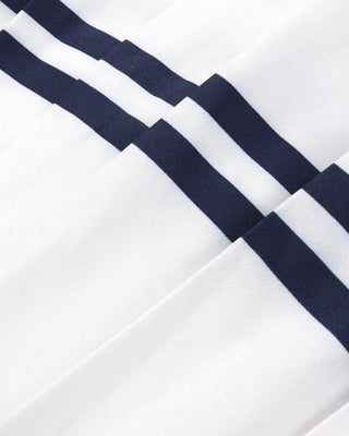 Close-up of a white fabric with navy blue stripes