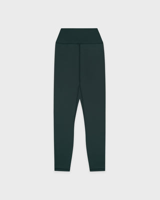 Dark green leggings on a light gray background