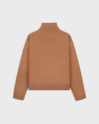 Brown sweater on a light gray background