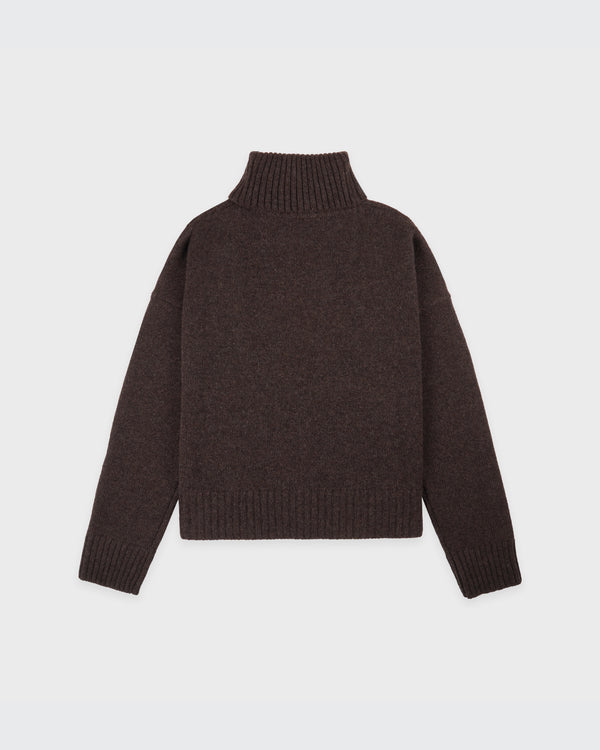 Brown sweater on a light gray background
