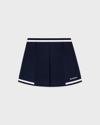 Navy blue skirt with white trim on a light gray background