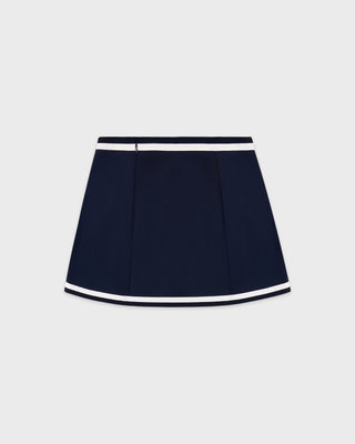 Navy blue skirt with white trim on a light gray background