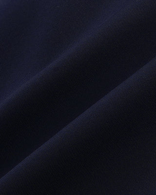 Close-up of dark blue fabric with a subtle pattern