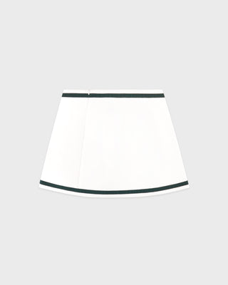 White skirt with black trim on a light gray background