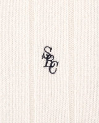 Textured fabric with a monogram logo in the center