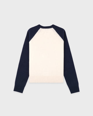 Navy and cream long-sleeve shirt on a light gray background