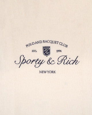 Logo of Sporty & Rich on a beige background