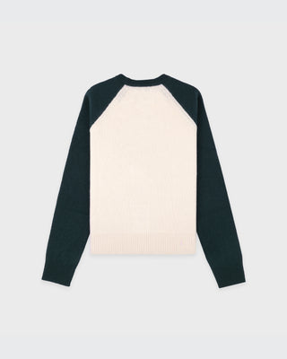 Long-sleeve shirt with black sleeves and cream body on a light gray background