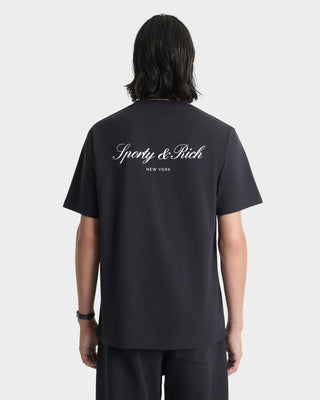 Person wearing a black t-shirt with 'Sporty & Rich' branding on the back, against a white background