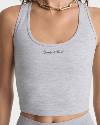 Gray sports bra with 'Sleek & Simple' branding on a white background