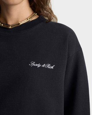 Black sweatshirt with 'Spicy & Rich' logo on a plain background
