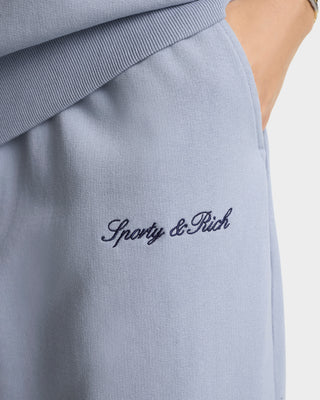 Light blue sweatshirt with 'Sporty & Rich' embroidery on a white background
