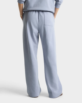 Light blue outfit with wide-leg pants on a white background