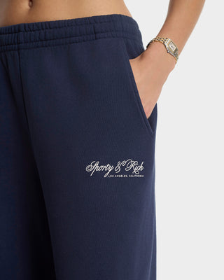 Navy blue sweatpants with a brand logo on a white background
