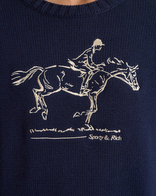 Navy sweater with embroidered horse and rider design and 'Sporty & Rich' branding.