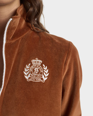 Brown jacket with a white logo on a plain background