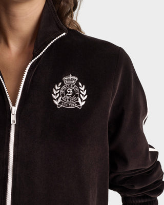 Brown jacket with a white embroidered logo on a neutral background