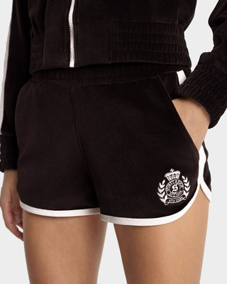Black shorts with a white emblem on a plain background