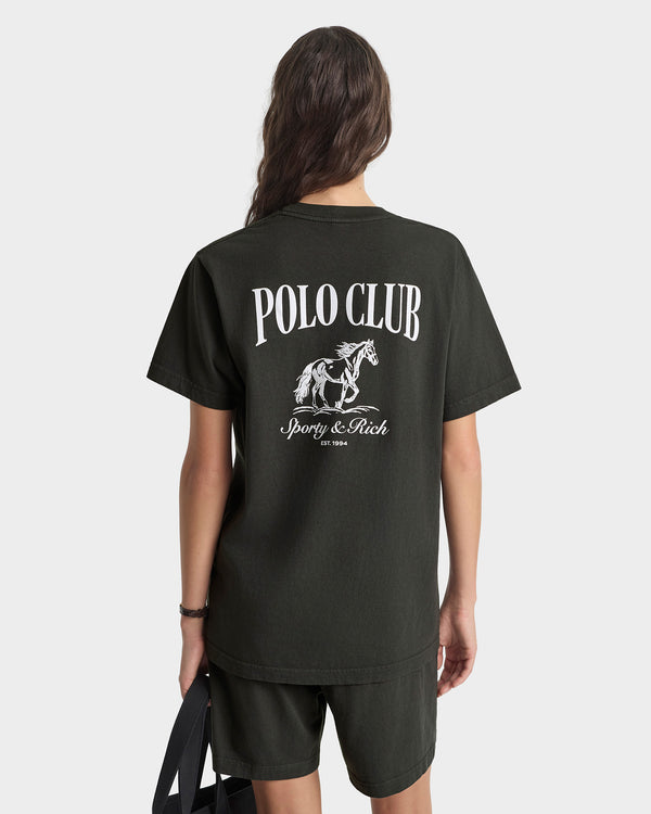Person wearing a black t-shirt with 'Polo Club' logo on the back, on a white background