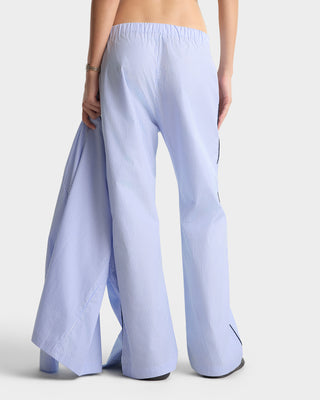 Light blue striped pants worn by a person on a white background