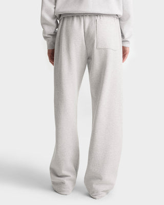 Light gray sweatpants worn by a person on a white background