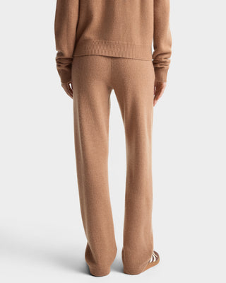 Brown knit sweater and pants set on a white background