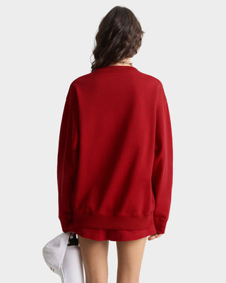 Person wearing a red sweatshirt on a white background